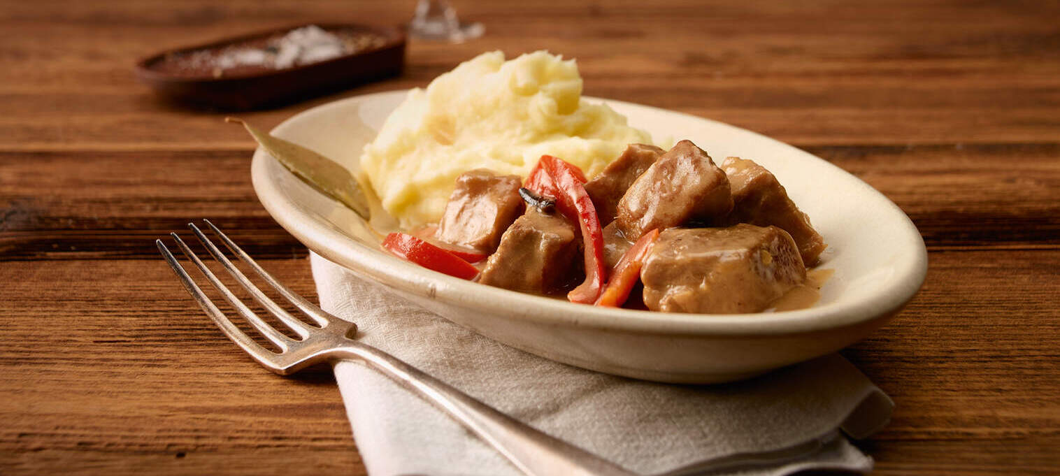 Schweinsragout mit Peperoni an Rahmsauce